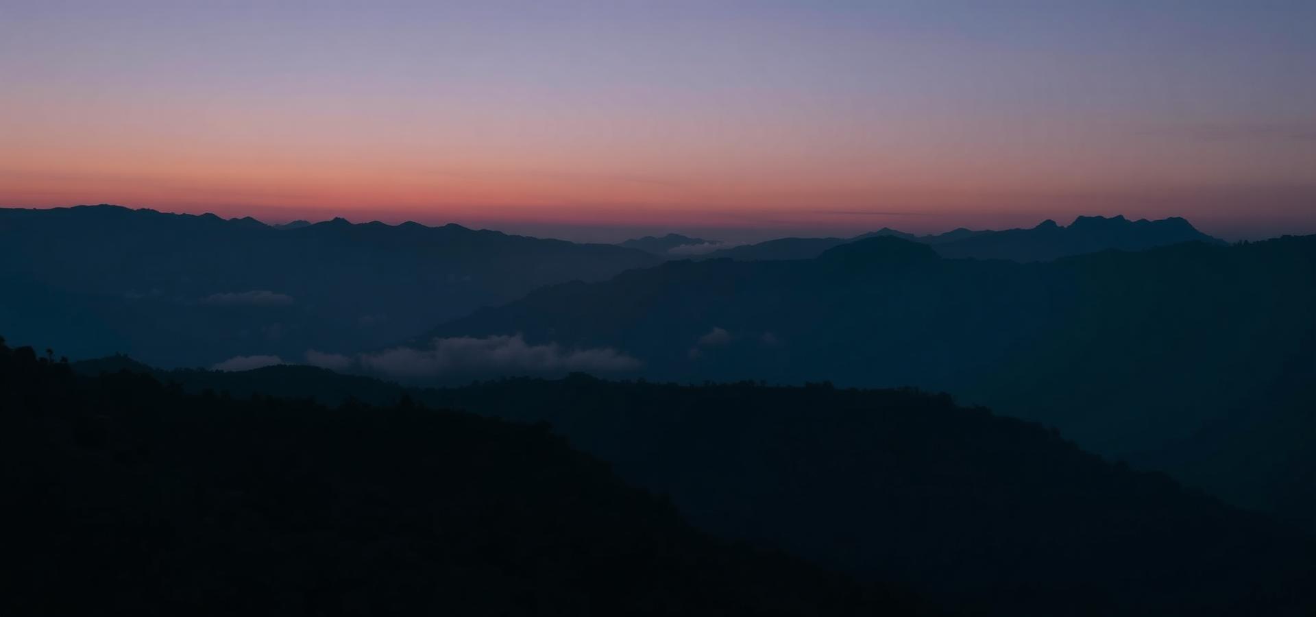 Layered Himalayan ridges near Lamahata, Darjeeling at dusk