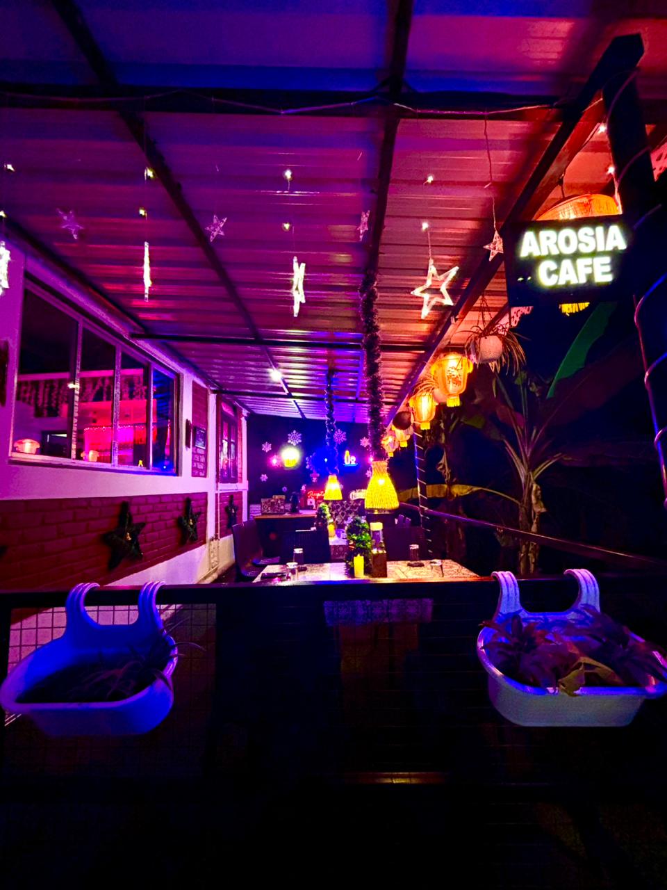 Arosia Cafe lit with lanterns and fairy lights in the evening
