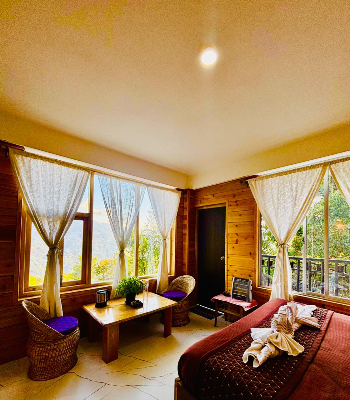 King Suite corner with wide windows looking out to the ranges