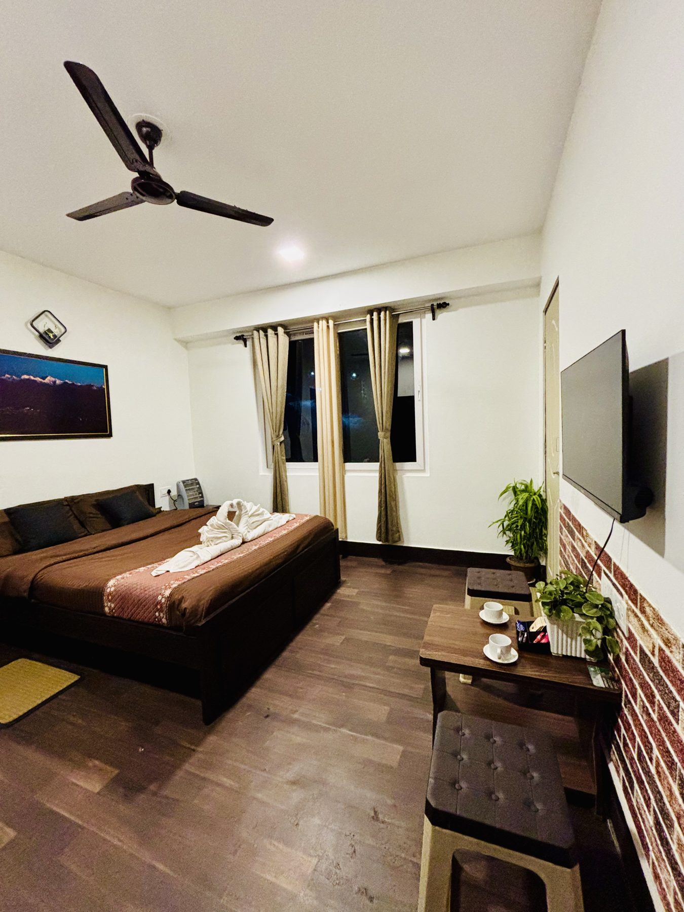 Private room at Arosia by The Hive with a large bed and mountain-facing window