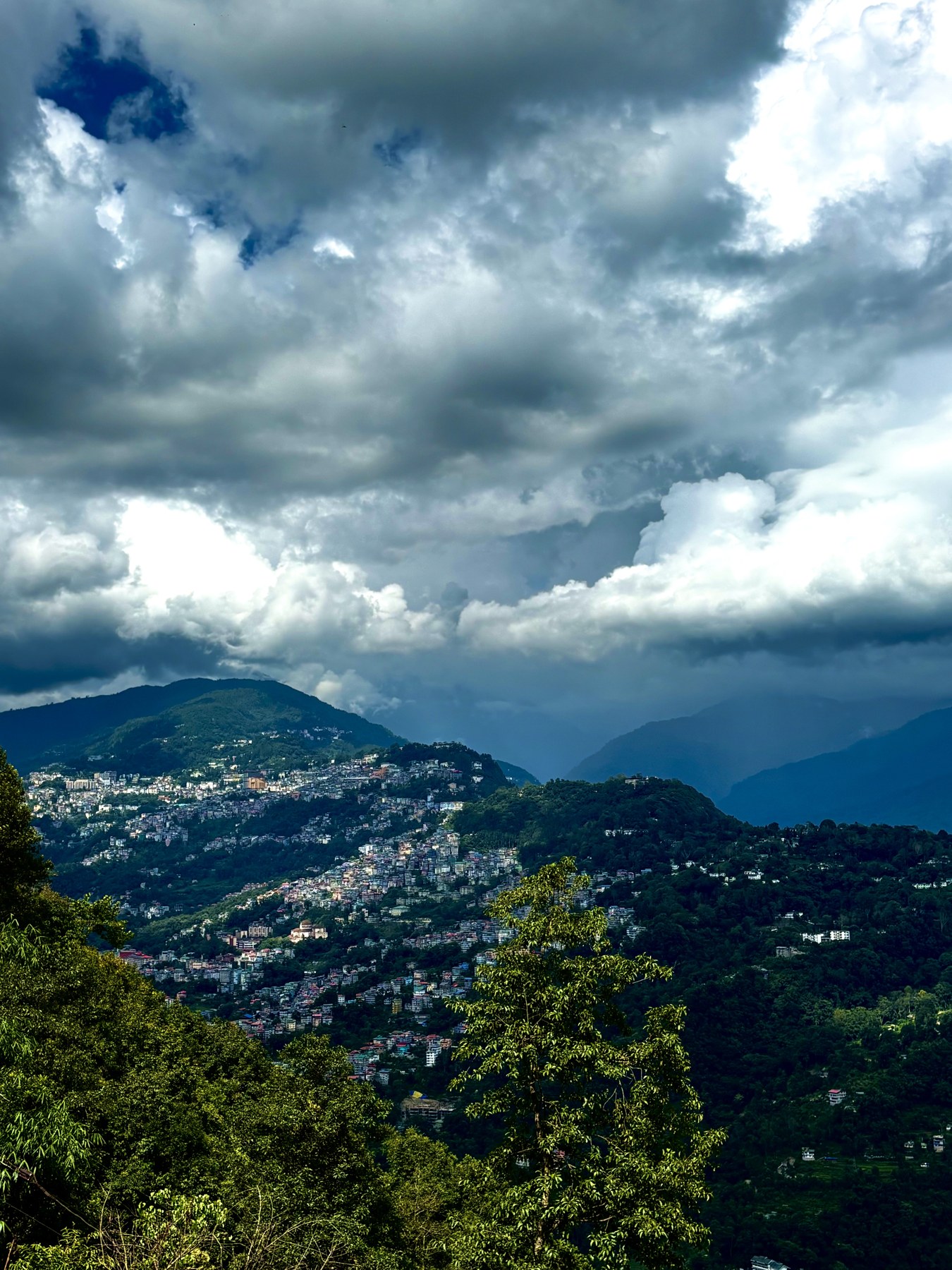Clouds rolling over the Himalayan ranges seen from Arosia in Rumtek